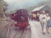 <h4><a href='/locations/N/Nant_Gwernol'>Nant Gwernol</a></h4><p><small><a href='/companies/T/Talyllyn_Railway'>Talyllyn Railway</a></small></p><p>A scene at Nant Gwernol terminus with a Talyllyn Railway train just arrived from Tywyn Wharf, in July 1980. 2/9</p><p>/07/1980<br><small><a href='/contributors/David_Bosher'>David Bosher</a></small></p>