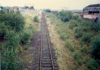 Dalmuir Riverside looking east. The bay platforms were to the left. The sidings on the right latterly served Arnott Young Shipbreakers but were originally for Beardmores Dalmuir Shipyard - the site now being a hospital.<br><br>[Ewan Crawford //1987]