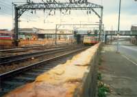 Near Eglinton Street Junction an inner Cathcart Circle train passes south under the former CGU approach to its Eglinton Street station (Cumberland Street). <br><br>[Ewan Crawford //1987]