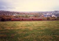Northbound DMU approaches Busby Junction. The East Kilbride line is in the background.<br><br>[Ewan Crawford //1987]