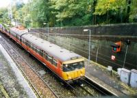 Eastbound train at Kirkhill about to enter the tunnel.<br><br>[Ewan Crawford //1987]