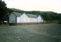 Fairlie, once Fairlie High, showing the building on the one time northbound platform. The goods yard to the right dealt with nuclear flask traffic from Hunterston.<br><br>[Ewan Crawford //1987]