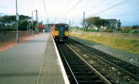 Largs-Glasgow train at Ardrossan South Beach. Eastbound platform removed.<br><br>[Ewan Crawford //1987]