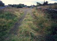 Remains of the goods yard at West Kilbride. Station is distant left and view looks to Ardrossan.<br><br>[Ewan Crawford //1987]