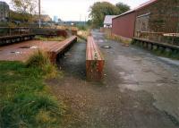 Bridge over a stream on the Dennyholm Mill siding. The view looks east to a level crossing.<br><br>[Ewan Crawford //1987]