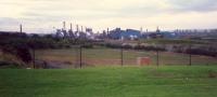 Ravenscraig Steelworks from the north. Ironworks and coke ovens to left, BOS centre and rolling mill right. The land in the foreground was once crossed by a coalmine railway.<br><br>[Ewan Crawford //1987]