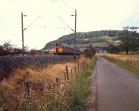 Eastbound train on the L&DR alignment approaching the former Dunglass Junction.<br><br>[Ewan Crawford //1987]