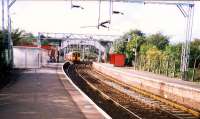 A Helensburgh train heads west at Dalreoch Junction viewed from the station.<br><br>[Ewan Crawford //1987]