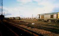 A pair of 37s on a Ravenscraig-Hunterston coal empties train heads west past 20 063 at Polmadie. Access by kind permission of British Rail.<br><br>[Ewan Crawford //1987]