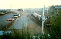 From Polmadie bridge looking east a short frieght can be seen passing. North British Locomotives Queen Park works was to the right.<br><br>[Ewan Crawford //1987]