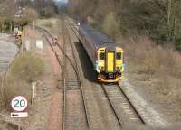 A Glasgow Central - Carlisle train north of Dumfries passing the junction with the former Port Road to Stranraer in April 2006. <br><br>[John Furnevel 17/04/2006]