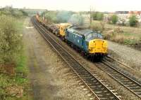 A 37 pulls a permanent way train south past the former Plean station.<br><br>[Ewan Crawford //1988]