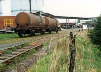 Two wagons, probably crippled, in the short siding at Glenochil Yeast in 1988.<br><br>[Ewan Crawford //1988]