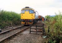 A 26 backs down on a train of Molasses at Cambus Junction. View looks west.<br><br>[Ewan Crawford //1988]