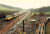 Northbound 125 diverted from the ECML passes through Beattock. Between the mainline on the left and siding on the right the Moffat Branch used to diverge off to the right at a lower level.<br><br>[Ewan Crawford //1988]