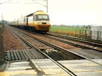 Diverted 43 074 approaches Cove level crossing.<br><br>[Ewan Crawford //1988]