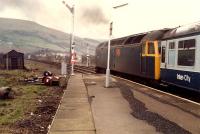 Southbound 47 leaves Girvan (New). Its a steep climb up to Pinmore. There was a bay platform to the left.<br><br>[Ewan Crawford 19/03/1988]