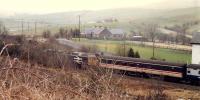 Northbound train passing the former Pinmore station and approaching the tunnel.<br><br>[Ewan Crawford 19/03/1988]