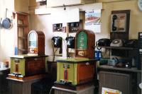 Interior of Barrhill station office. Telephones, token machines and frying pans (obviously).<br><br>[Ewan Crawford 19/03/1988]