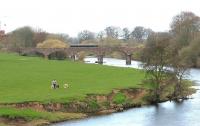 Walking the dogs - Dumfries 2006. The arched bridge across the Nith carried the  line to Castle Douglas (1859) and later on to Stranraer. Beyond it is the road bridge built to carry the Dumfries by-pass 130 years later. View is north.<br><br>[John Furnevel 17/04/2006]