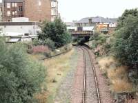 Looking west over the remains of Easter Road station 1n 1997. The line now terminates at the Powderhall refuse depot. The trackbed on the left came in from Abbeyhill Junction.<br><br>[John Furnevel 15/10/1997]