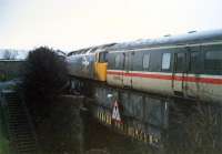 Stranraer-London train passing the St Marnock groundframe and approaching Kilmarnock.<br><br>[Ewan Crawford //1988]