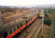 Trains pass at Strathclyde Junction in 1988. To the left is the high level Switchback line and the trains are on the low level Glasgow Central line.<br><br>[Ewan Crawford //1988]