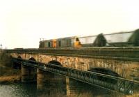 A pair of 20s crosses the Clydebridge viaduct heading west with a train of empty coal wagons.<br><br>[Ewan Crawford //1988]