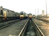 Miscellaneous diesel locomotives stabled over redundant ash pit roads at Newton Heath, Manchester, in June 1969. Much clearance of items relating to the age of steam had already taken place by this time, with the old coaling plant in the right background next on the list for the demolition squad.  <br><br>[John Furnevel 01/06/1969]