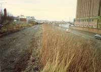 Site of Partick West looking east to Partick East Junction. There were 3 westbound platforms here and to the left 2 northbound platforms. Meadowside granary to right. Granary and railway both now gone - despite plans to re-open some of the railway.<br><br>[Ewan Crawford //1988]