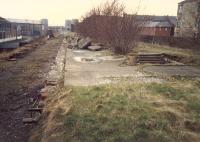 Scotstoun East looking west. Platform edging removed as part of preparation to make the route into a walkway. Note the steps down to street level on the right.<br><br>[Ewan Crawford //1988]