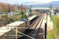 Heading home. With the Pentland Hills forming the backdrop, a class 37 takes empty Binliner containers west through Wallyford in April 2006 on its way back from Oxwellmains to Powderhall.<br><br>[John Furnevel 25/04/2006]