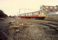 303 passing Knightswood South Junction looking south to Anniesland. The original line is in the foreground (just lifted, recently re-opened) and Glasgow City and District link to the right. Access by kind permission of British Rail.<br><br>[Ewan Crawford //1988]