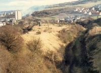 Looking east to where the G&SW crossed over the Wemyss Bay line east of Cartburn Tunnel. The Inchgreen line was in a cutting to the left, the G&SW line is in the foreground and it crosses the Wemyss Bay line in the middle distance.<br><br>[Ewan Crawford //1988]