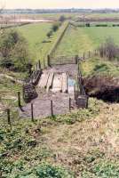 Looking west from Twechar. The station was behind the camera. Note the wooden supports for the removed rails.<br><br>[Ewan Crawford //1990]