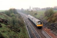 Eastbound DMU passing Woodilee.<br><br>[Ewan Crawford //1990]