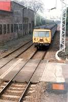 A 311 on an eastbound service approaches Bowling signalbox. Access by kind permission of British Rail.<br><br>[Ewan Crawford //1990]