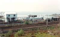 Dunglass Junction showing the L&D line (nearer) leaving the older NBR route (single track) which entered the Dunglass ESSO terminal. This terminal is now much cut back and no longer rail connected. Note wagon in siding.<br><br>[Ewan Crawford //1990]