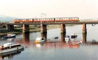 303 crossing the River Leven just west of Dumbarton Central.<br><br>[Ewan Crawford //1990]