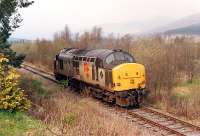 Having passed under the West Highland 37 403 heads west to Crianlarich Lower Junction to run back to Glasgow light engine.<br><br>[Ewan Crawford //1990]