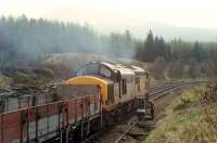 37 403 heading south from Crianlarich with a not particularly taxing load. Access by kind permission of British Rail.<br><br>[Ewan Crawford //1990]