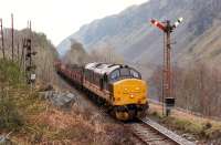 37 405 heading west from Loch Awe to the Pass of Brander. The signals are part of Anderson's Piano which detects rockfalls.<br><br>[Ewan Crawford //1990]