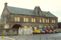 To the immediate south of Inverness station was this building. Possibly warehouses associated with the railway? Station to right and further right the south goods yard. The building has now been re-located within Inverness and renovated. The arch on the left was a former entry point to the goods yard.<br><br>[Ewan Crawford //]