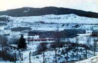 Short train sitting in the depot at Glen Douglas. West Highland line on hillside in background.<br><br>[Ewan Crawford //]