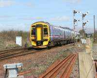 Southbound train approaching Larbert Junction in April 2006 signalled for Carmuirs East and the Edinburgh line.<br><br>[John Furnevel 26/04/2006]