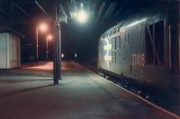 37416 with the train to Kyle of Lochalsh under the roadbridge at Dingwall.<br><br>[Ewan Crawford 03/01/1989]