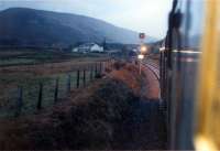 <h4><a href='/locations/A/Achnasheen'>Achnasheen</a></h4><p><small><a href='/companies/D/Dingwall_and_Skye_Railway'>Dingwall and Skye Railway</a></small></p><p>37416 approaches Achnasheen from the east at dawn. 31/45</p><p>03/01/1989<br><small><a href='/contributors/Ewan_Crawford'>Ewan Crawford</a></small></p>