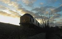 A 37 hauling the sleeper to Fort William approaching Cardross.<br><br>[Ewan Crawford 29/04/2006]