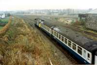 An Inverness bound train passes the former Perth goods yard. This has been lifted and built on.<br><br>[Ewan Crawford //1988]