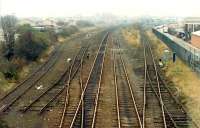 Looking south towards Perth. The sidings of Perth goods yard are to the left and to the right are an oil depots sidings.<br><br>[Ewan Crawford //1988]